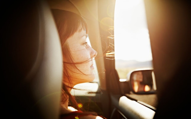 Woman Looking out of Window of Car